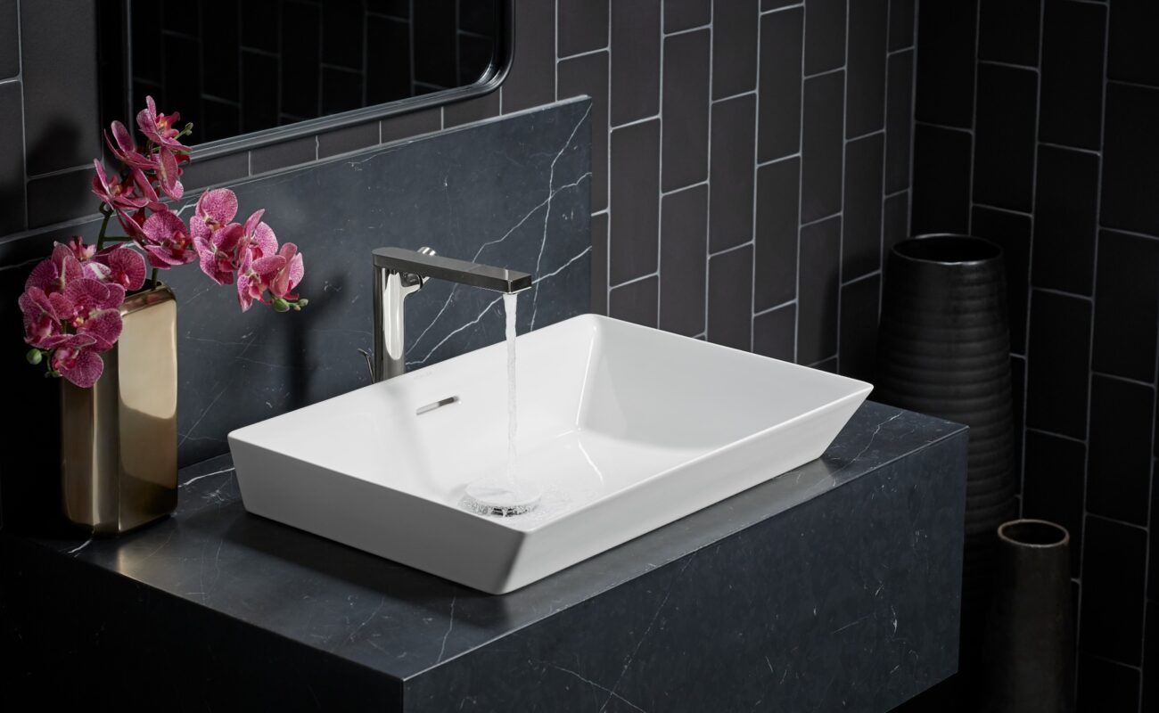 Sink with running water, representing emergency plumbing repair